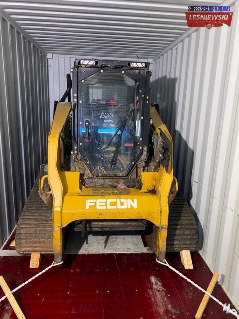 Fecon compact track loader in a container — machinery transport from the USA