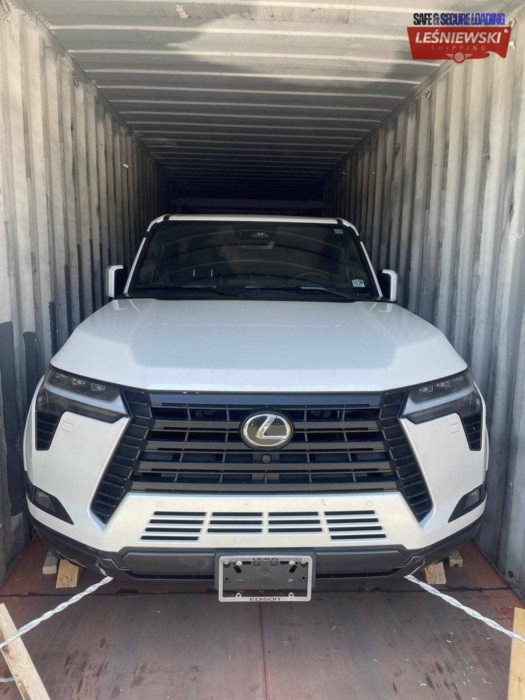 White Lexus GX SUV secured in a container — car shipping USA to Poland