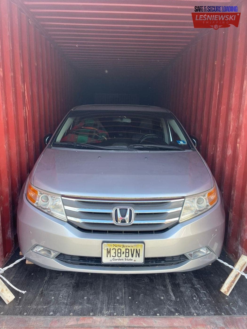 Honda Odyssey minivan secured in a container — car import from the USA