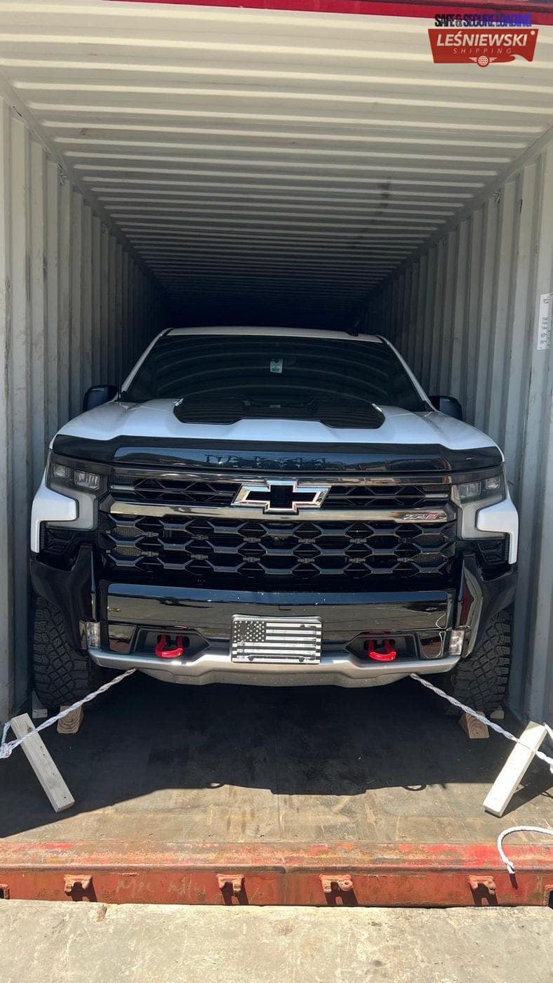 Chevrolet Silverado pickup secured in a container — car import from the USA